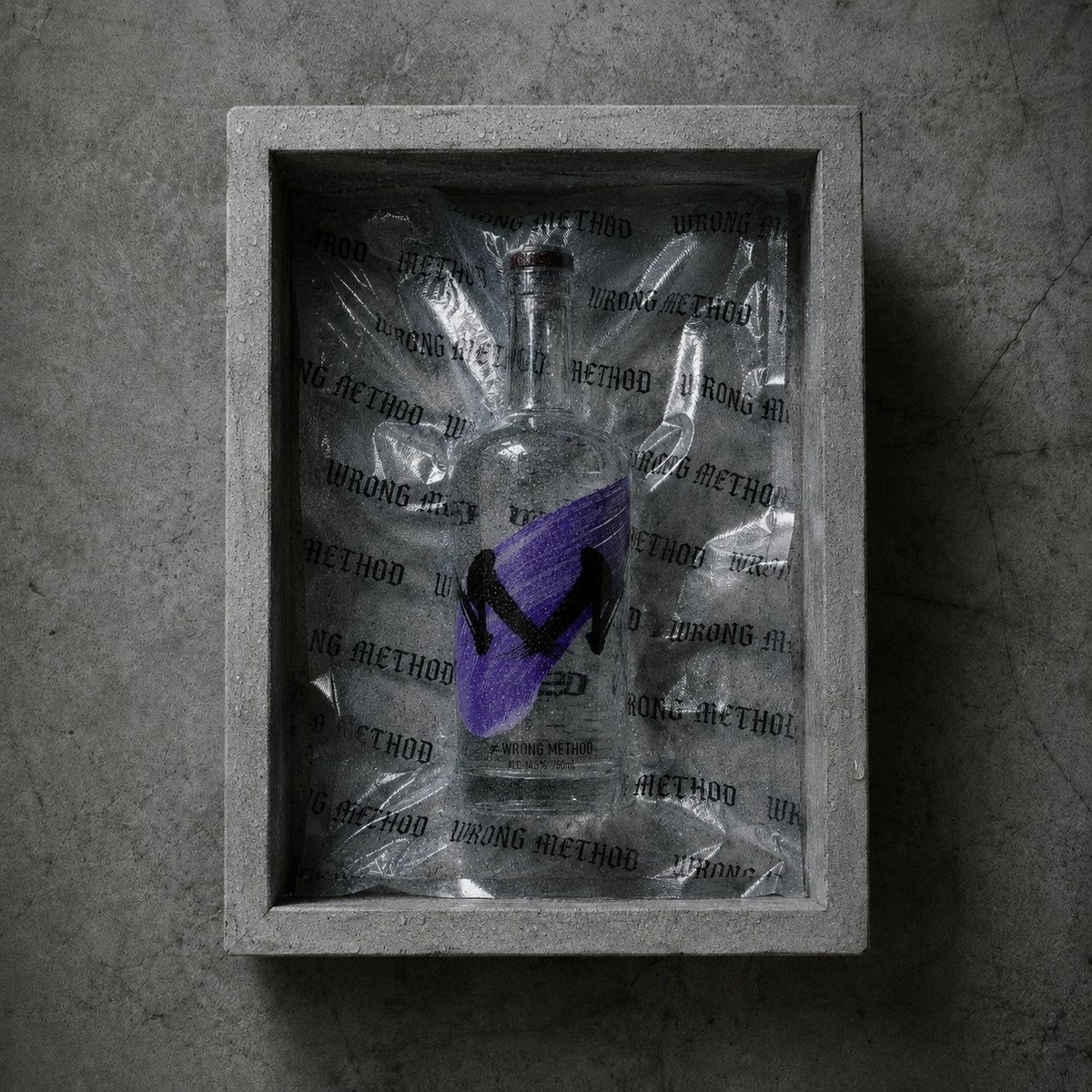 A bottle of WRONG METHOD sake resting in a concrete box